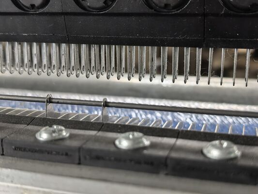 The Guide Bar System: Ensuring Accurate Yarn Guidance in Warp Knitting Machines